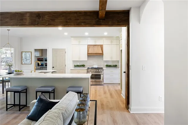a kitchen with a sink cabinets and window