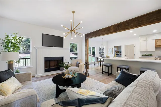 a living room with furniture fireplace and a flat screen tv