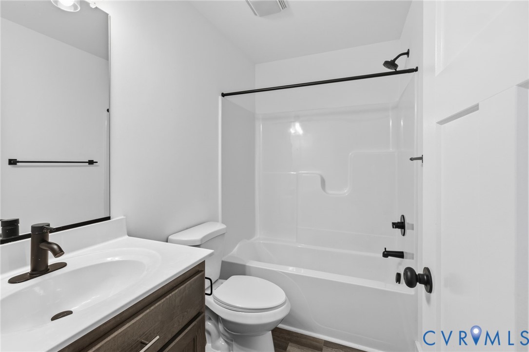 5245 Courtland Road Disputanta, VA 23842 - Photo 20 of 27 a bathroom with a sink a toilet and a bathtub