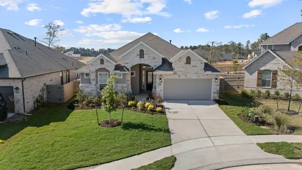 an aerial view of residential house with outdoor space and swimming pool