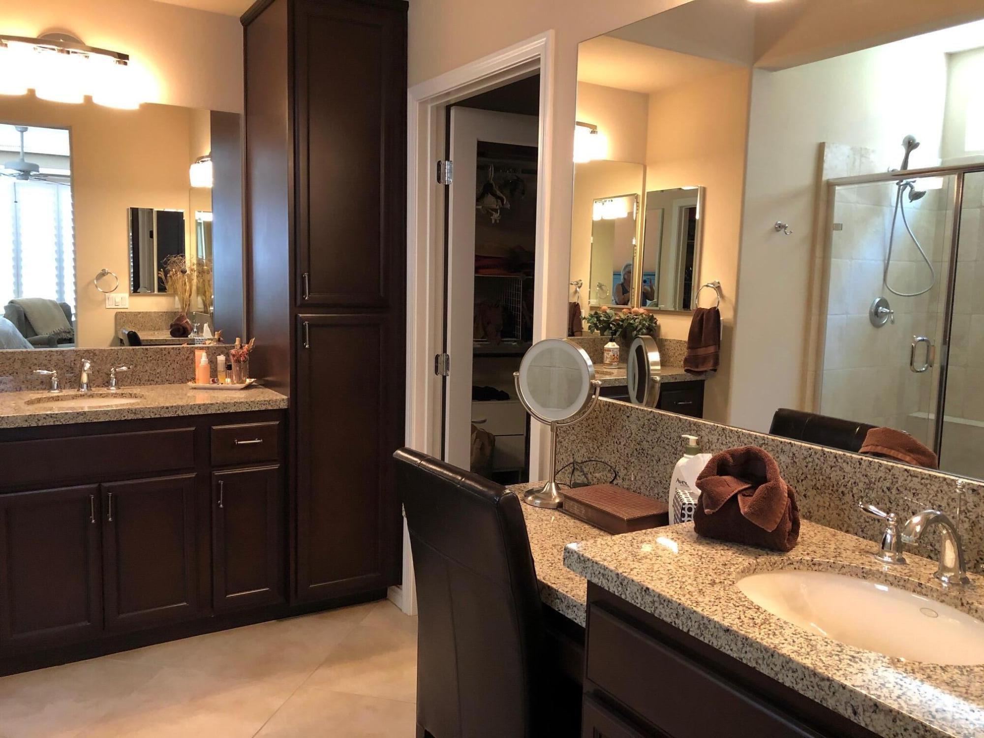 81565 Rustic Canyon Drive La Quinta, CA 92253 - Photo 9 of 12 a bathroom with a granite countertop sink and a mirror