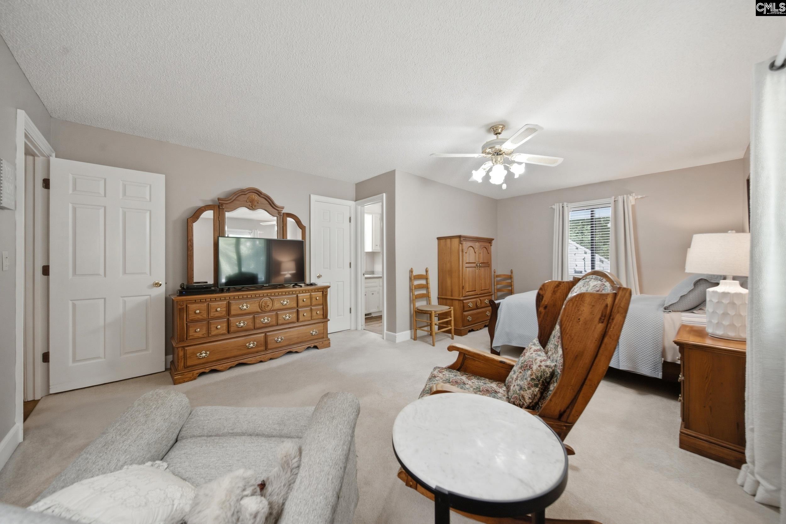 4324 Syrup Mill Road Ridgeway, SC 29130 - Photo 17 of 61 a living room with furniture and a chandelier