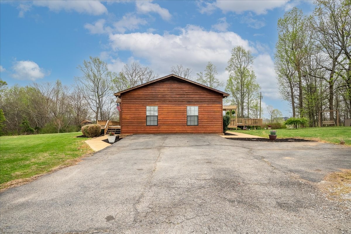 79 French Road Loretto, TN 38469 - Photo 5 of 52 a view of a house with backyard and trees