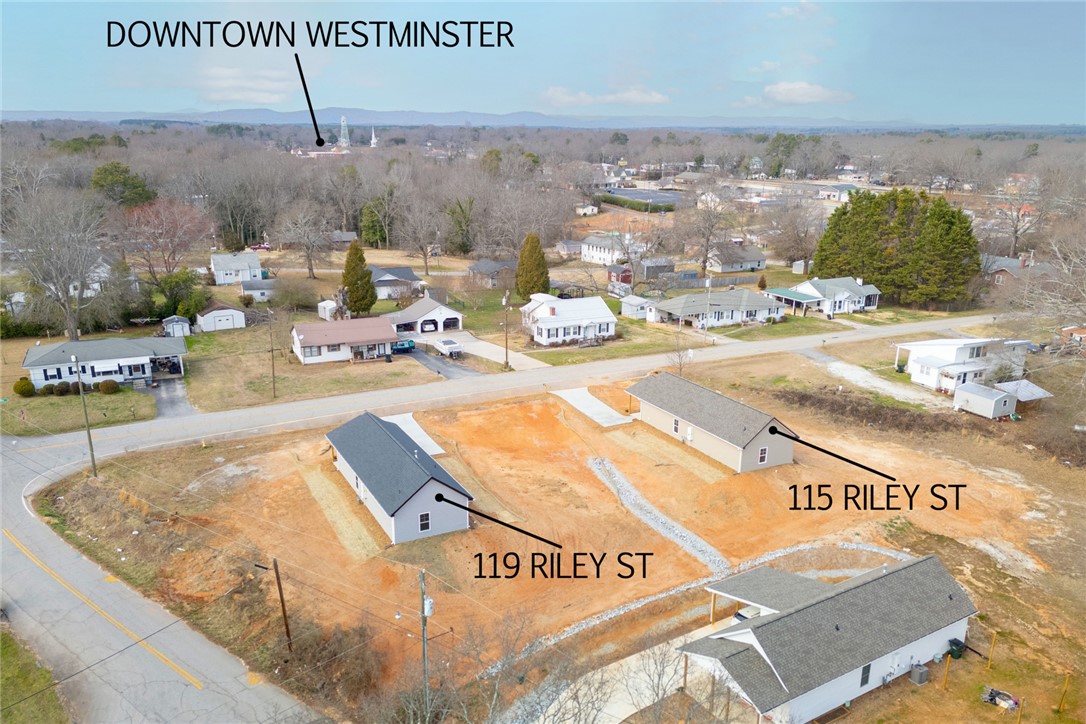 115 Riley Street Westminster, SC 29693 - Photo 29 of 46 An expansive aerial view showcases a vibrant community nestled in a picturesque, verdant landscape.