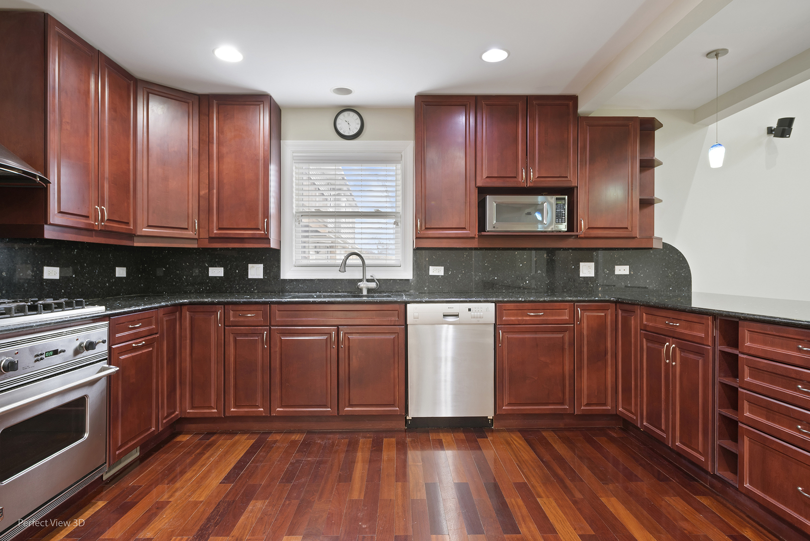 3070 Koepke Road Northbrook, IL 60062 - Photo 10 of 27 a kitchen with granite countertop wooden cabinets stainless steel appliances and a window