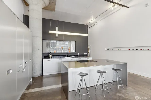 a kitchen with a stove and a white cabinet