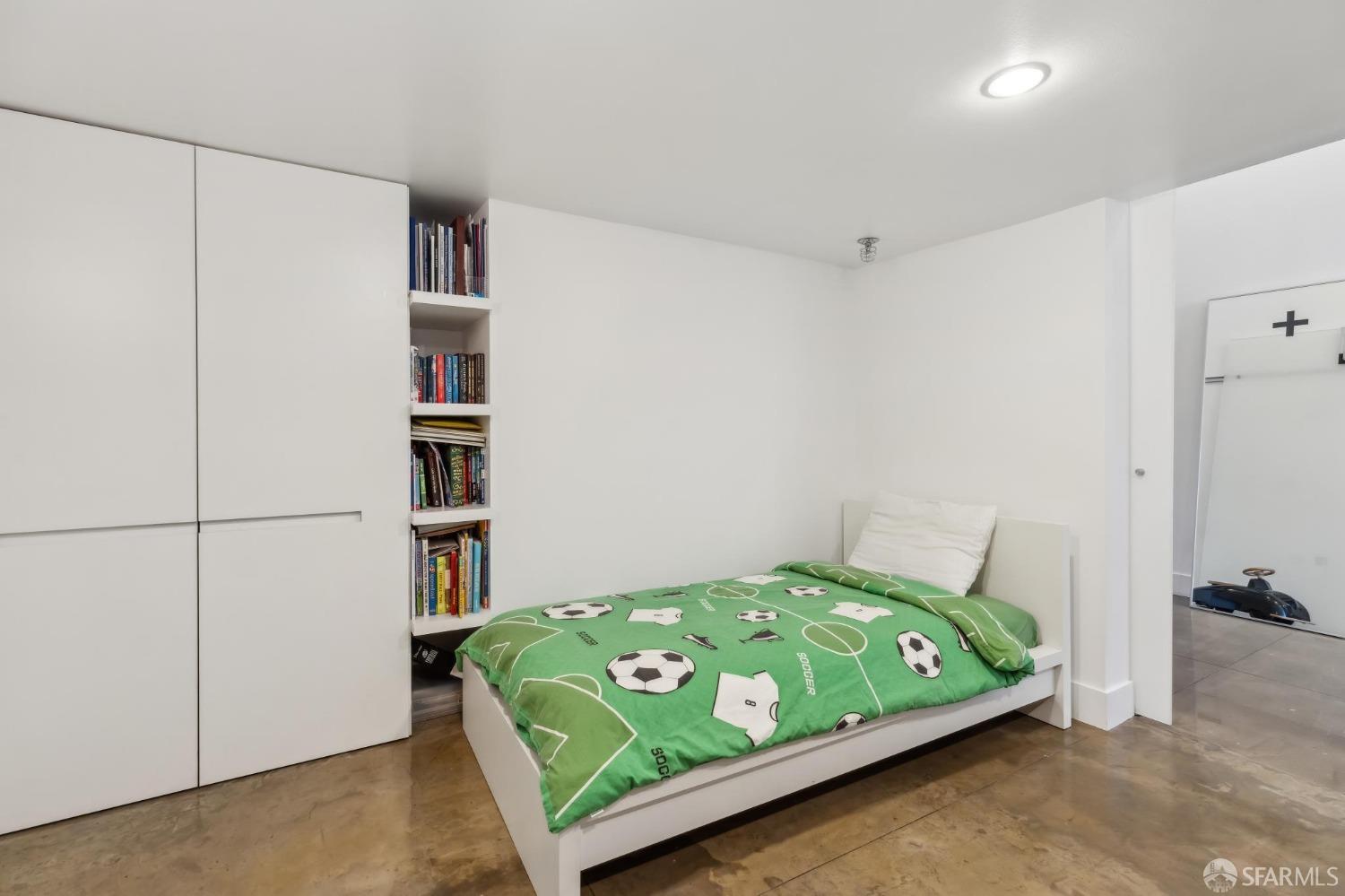 461 2nd Street, Unit 558T San Francisco, CA 94107 - Photo 30 of 37 a bedroom with a bed and a book shelf