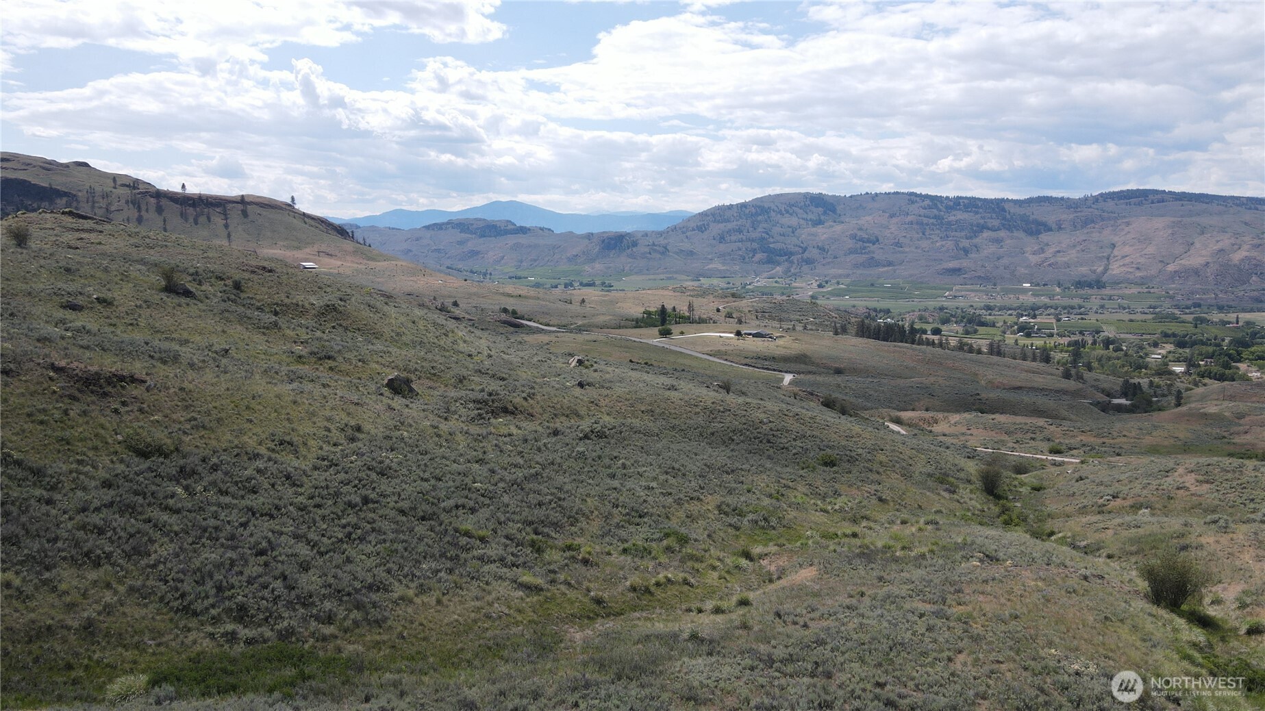 -lot B Swanson Mill Road Oroville, WA 98844 - Photo 10 of 13 a view of a dry field with mountains in the background