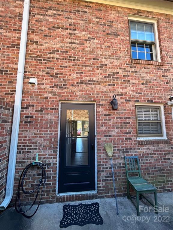 6300 Old Pineville Road Charlotte, NC 28217 - Photo 4 of 4 a brick building with a bench