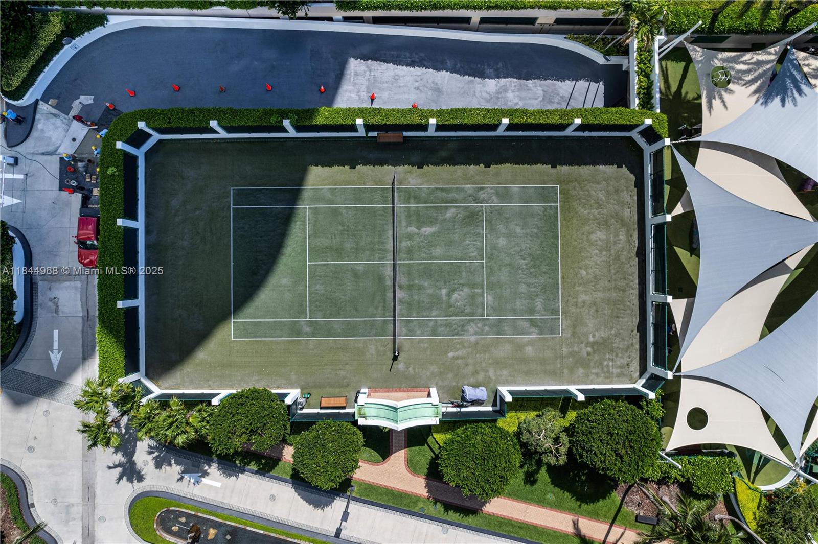 900 Brickell Key Boulevard, Unit 2005 Miami, FL 33131 - Photo 18 of 19 a front view of a house with a yard