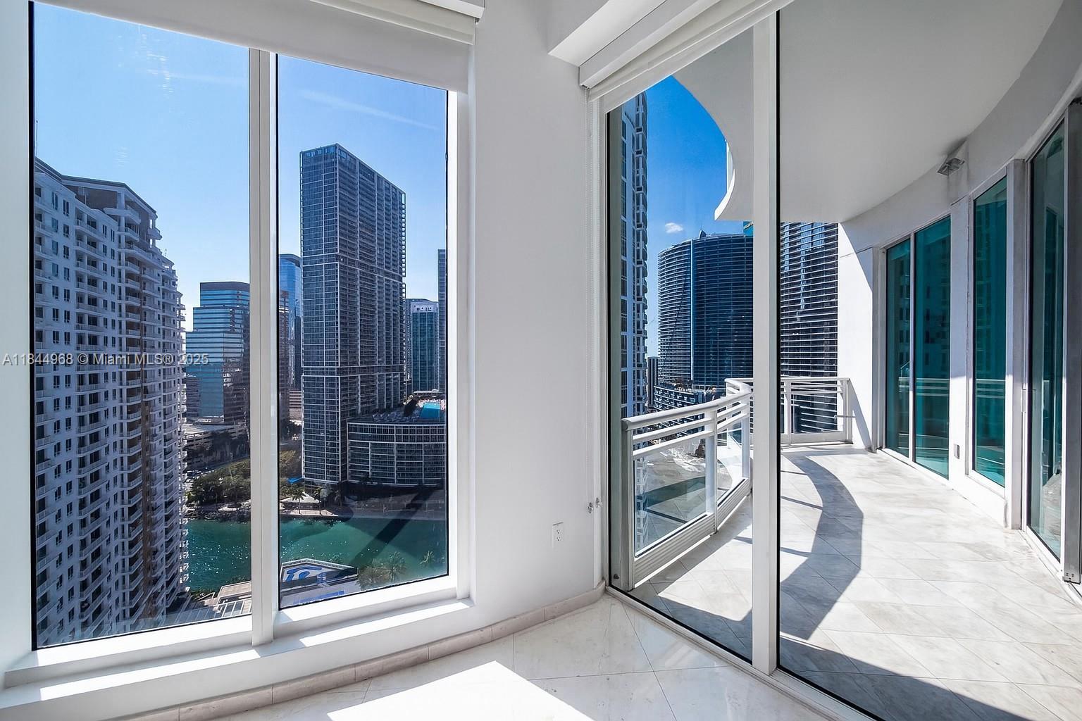 900 Brickell Key Boulevard, Unit 2005 Miami, FL 33131 - Photo 8 of 19 a view of a balcony and floor to ceiling window