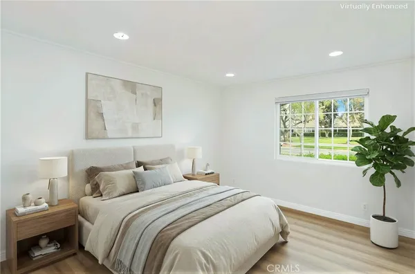 a bedroom with bed and a window