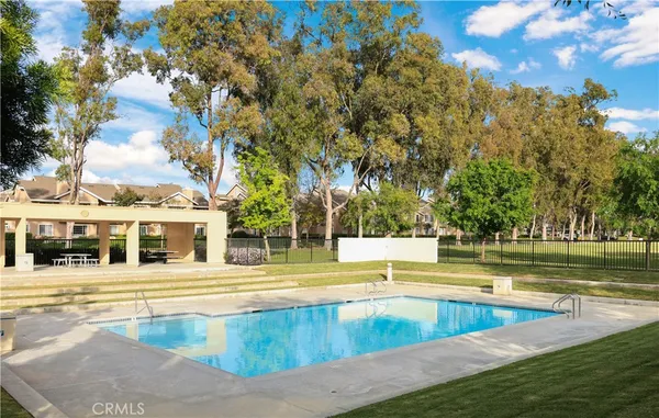 swimming pool view with a outdoor seating