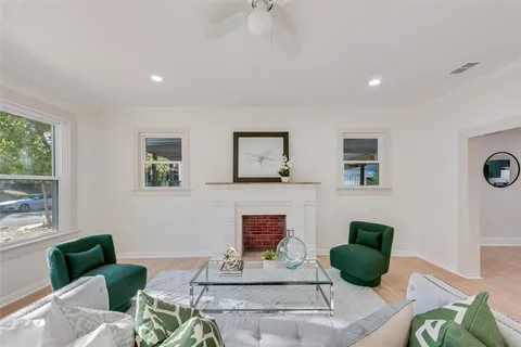 a living room with furniture and a potted plant