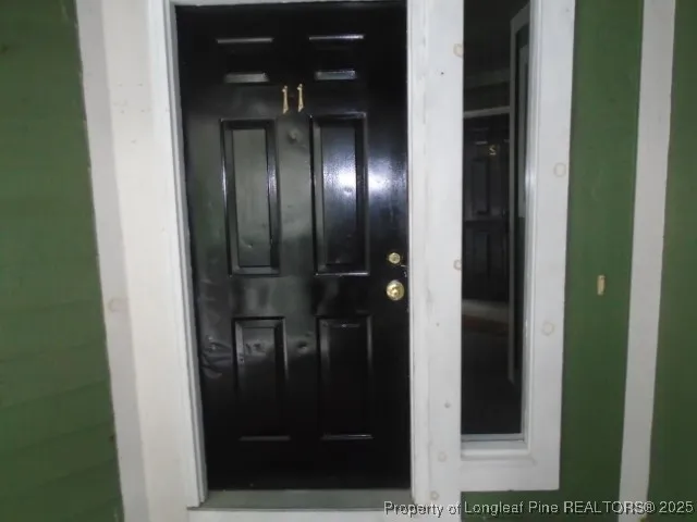 a bathroom with a glass door shower