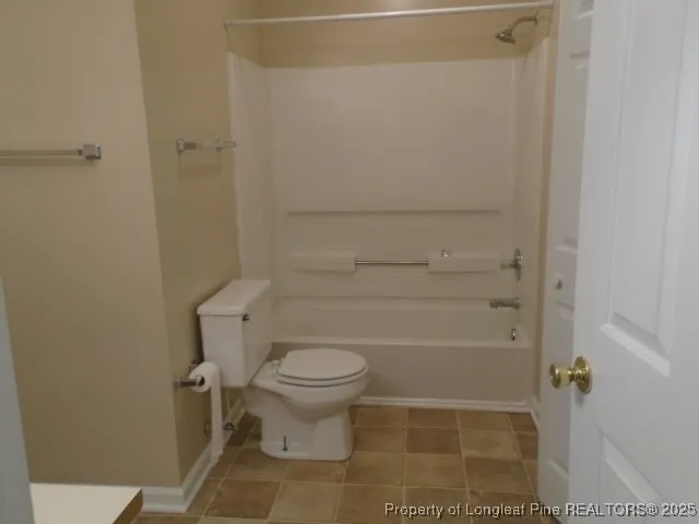 a bathroom with a glass door shower