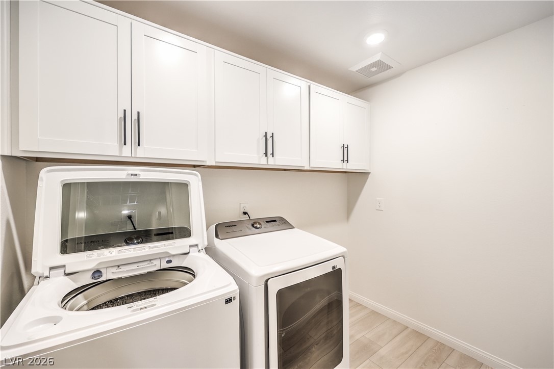 3782 Alla Rocca Avenue Henderson, NV 89044 - Photo 38 of 55 This dedicated laundry area offers practical convenience with ample storage and durable flooring.