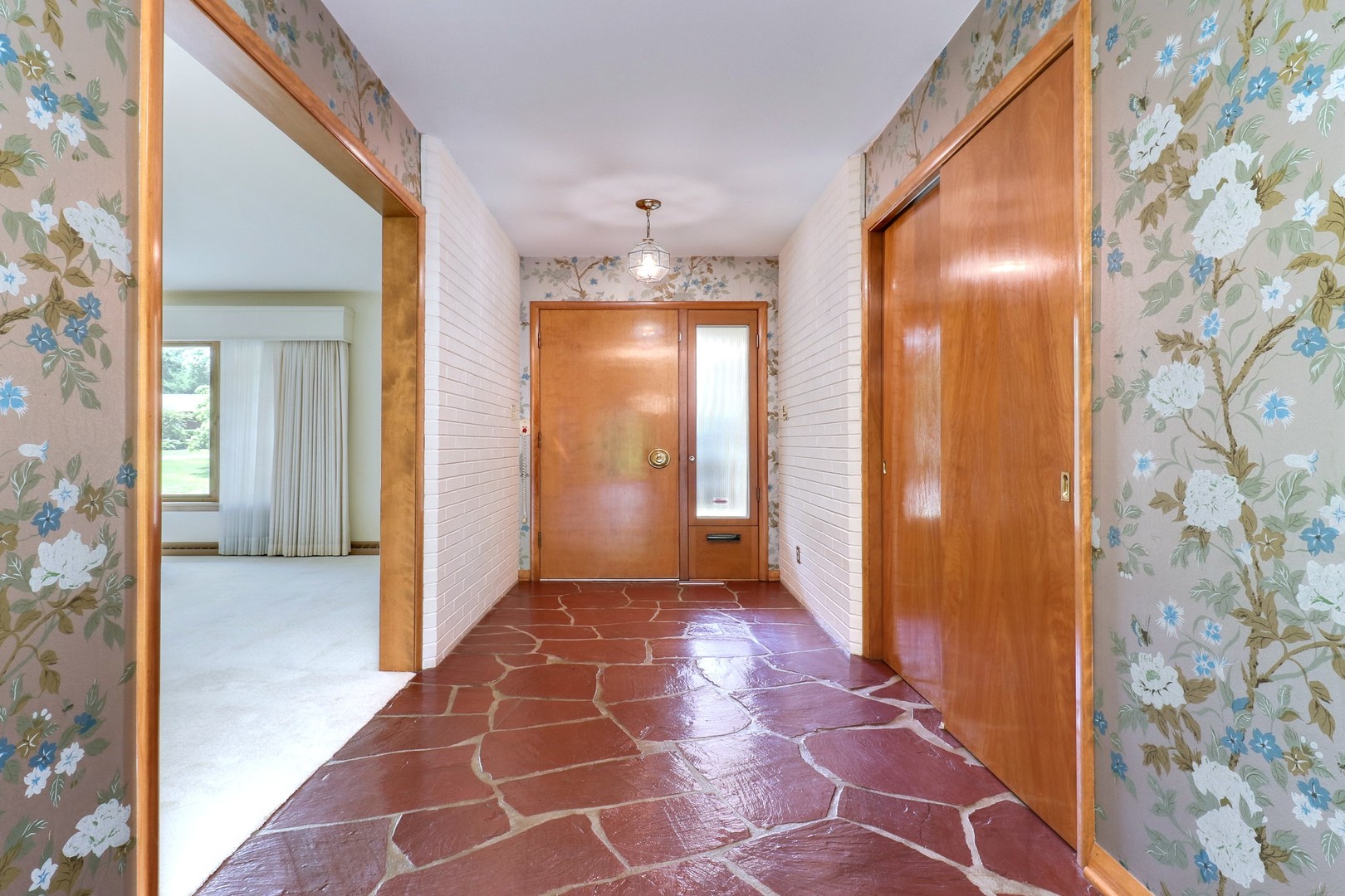 10 Kent Drive Normal, IL 61761 - Photo 5 of 73 a view of a hallway with wooden floor and a bathroom