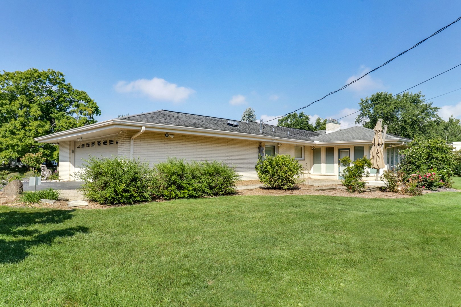 10 Kent Drive Normal, IL 61761 - Photo 62 of 73 a front view of a house with a yard and potted plants