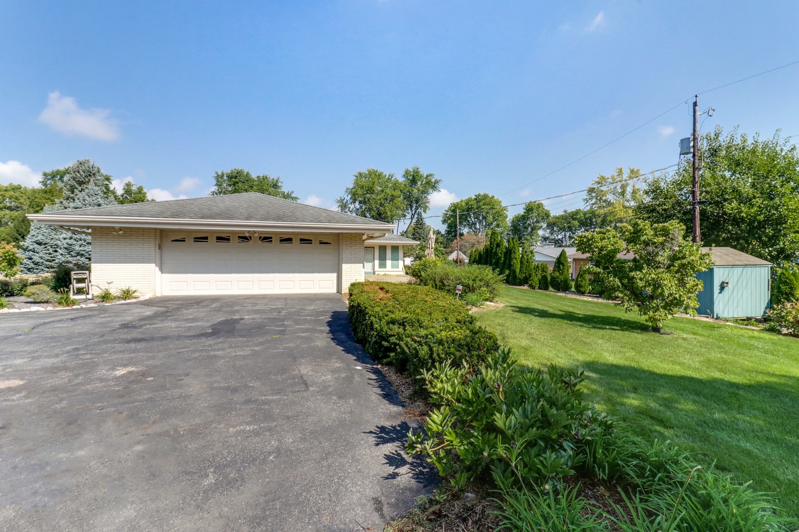 10 Kent Drive Normal, IL 61761 - Photo 71 of 73 a front view of a house with a yard and potted plants