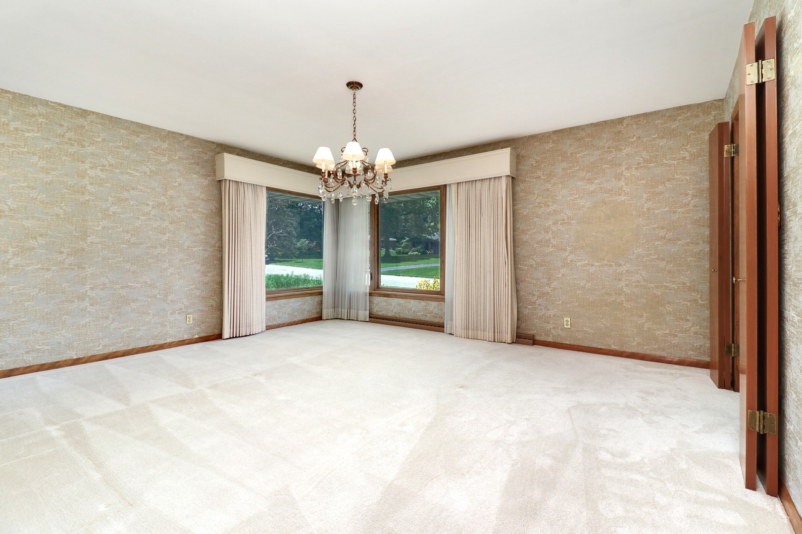 10 Kent Drive Normal, IL 61761 - Photo 8 of 73 a view of an empty room with chandelier and bathroom