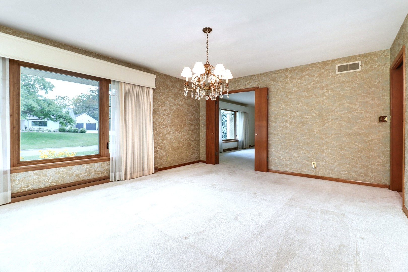 10 Kent Drive Normal, IL 61761 - Photo 9 of 73 a view of a livingroom with a chandelier curtains and large windows