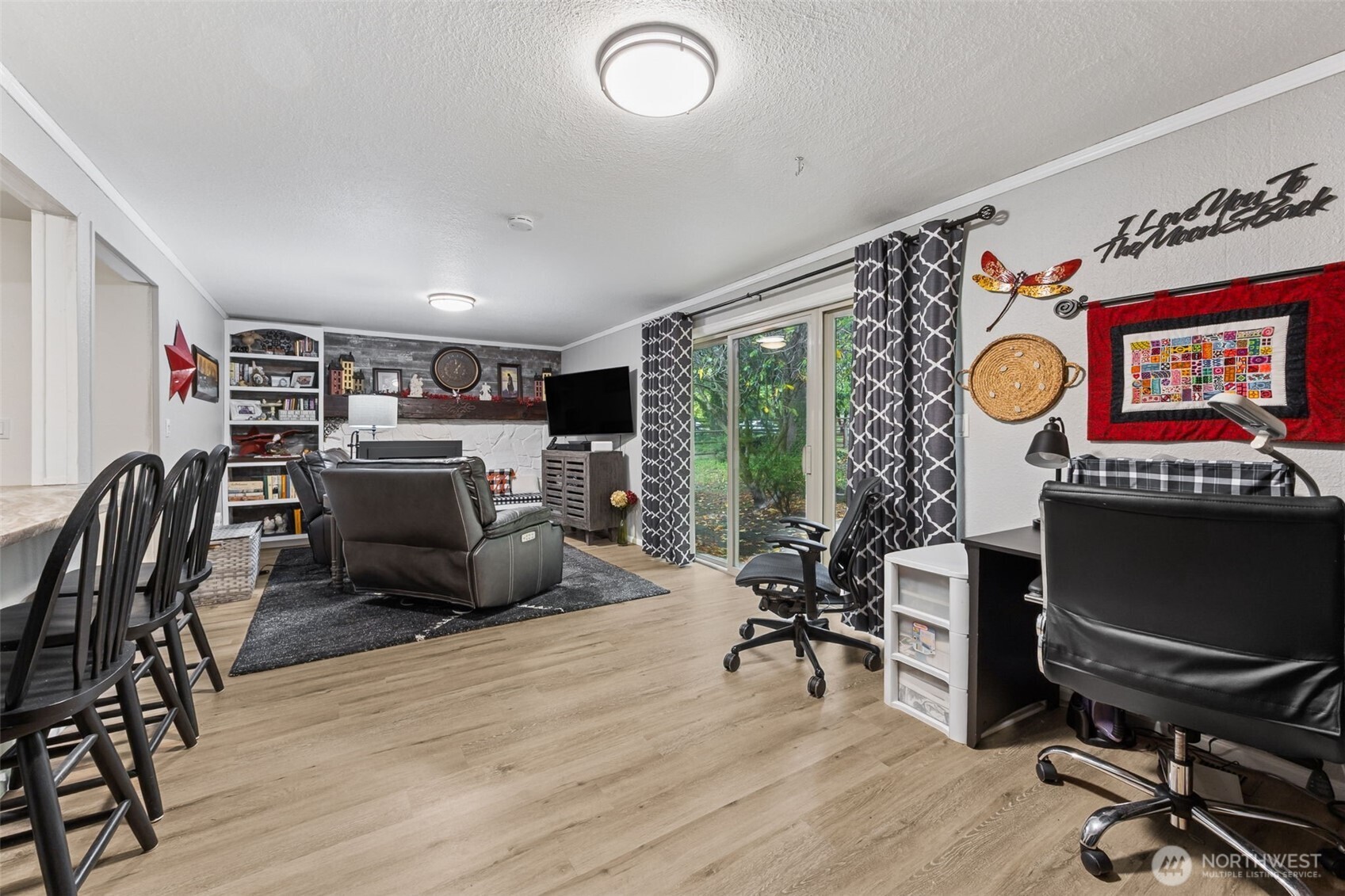 5700 Cooper Point Road Northwest Olympia, WA 98502 - Photo 15 of 31 a view of a livingroom with workspace and a window