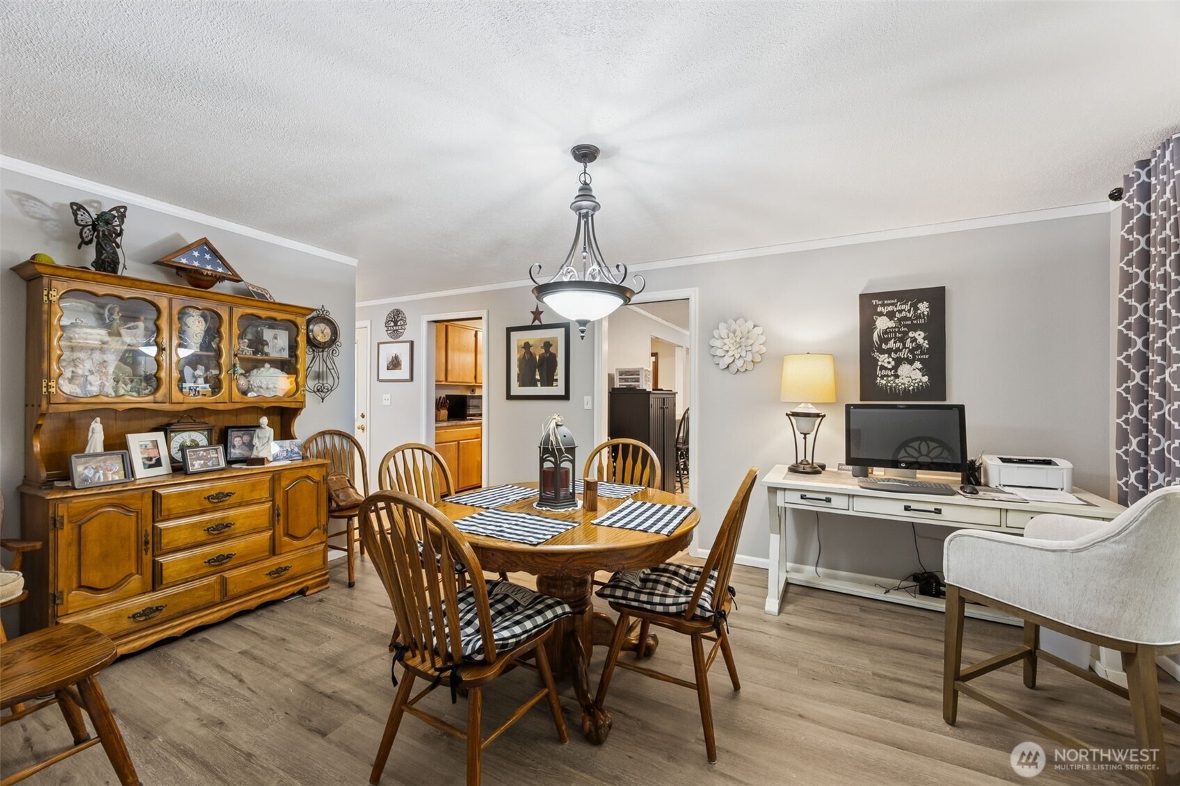 5700 Cooper Point Road Northwest Olympia, WA 98502 - Photo 18 of 31 a dining room with furniture and wooden floor