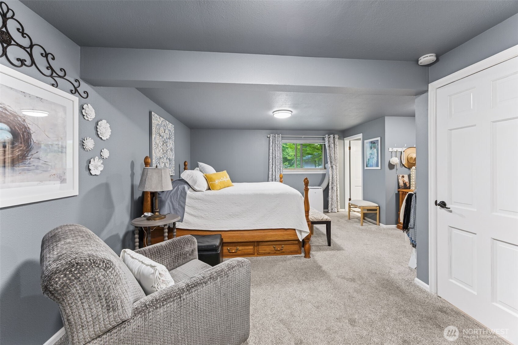 5700 Cooper Point Road Northwest Olympia, WA 98502 - Photo 19 of 31 a bedroom with furniture and a window