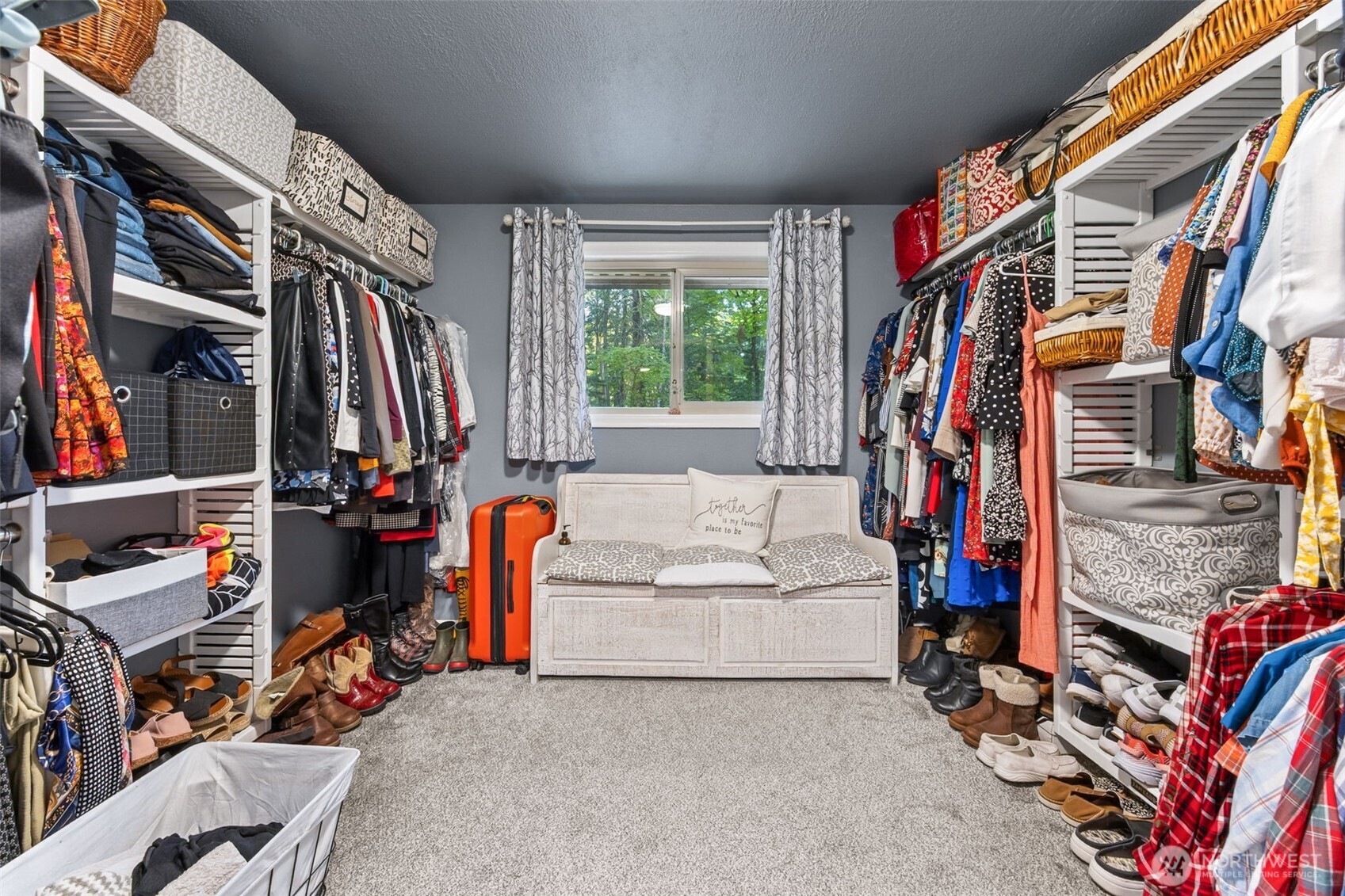 5700 Cooper Point Road Northwest Olympia, WA 98502 - Photo 22 of 31 a view of walk in closet with clothes and shoes