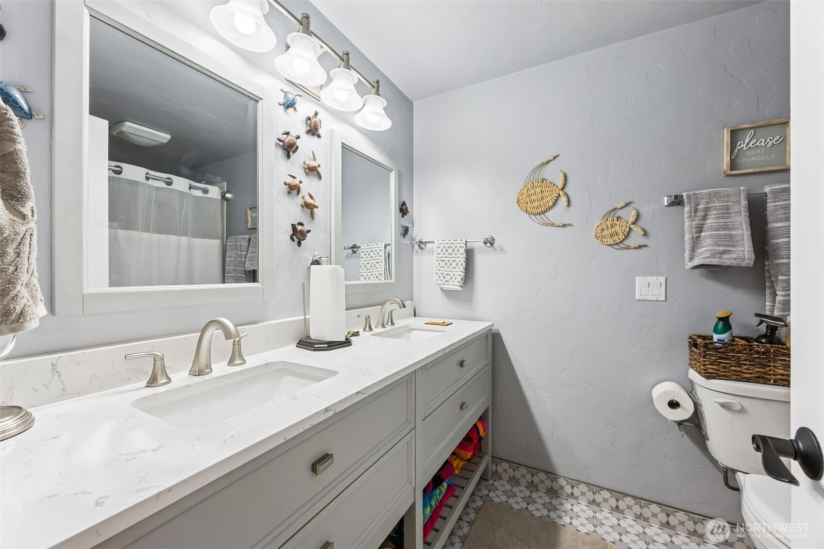 5700 Cooper Point Road Northwest Olympia, WA 98502 - Photo 25 of 31 a bathroom with a sink and a mirror