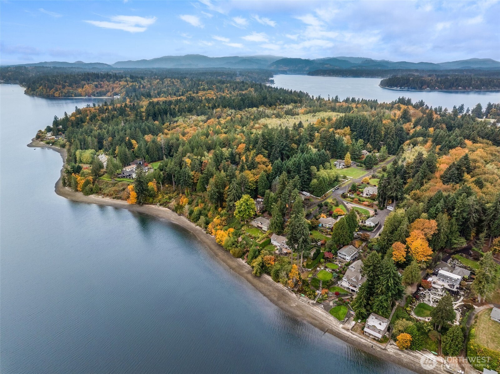 5700 Cooper Point Road Northwest Olympia, WA 98502 - Photo 28 of 31 an aerial view of residential houses with outdoor space and river