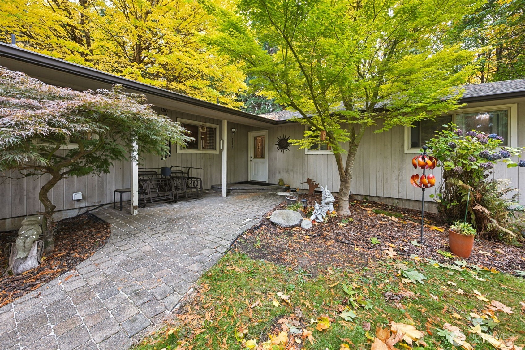 5700 Cooper Point Road Northwest Olympia, WA 98502 - Photo 7 of 31 a backyard of a house with yard and outdoor seating