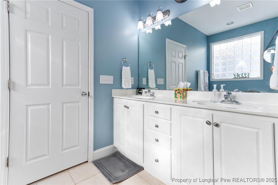58 Cottswold Lane Spring Lake, NC 28390 - Photo 18 of 47 a bathroom with a sink vanity and a mirror