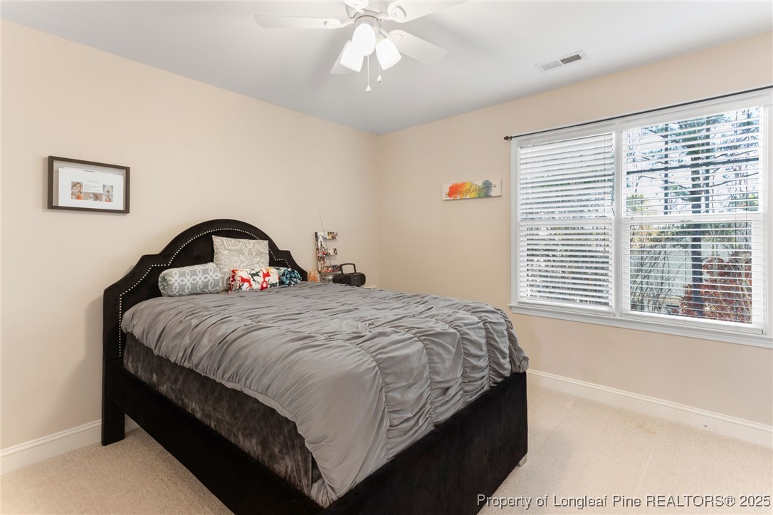 58 Cottswold Lane Spring Lake, NC 28390 - Photo 25 of 47 a bedroom with a bed and a window