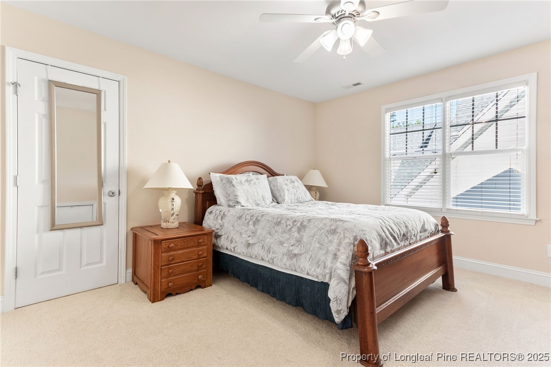 58 Cottswold Lane Spring Lake, NC 28390 - Photo 26 of 47 a spacious bedroom with a bed a window and closet
