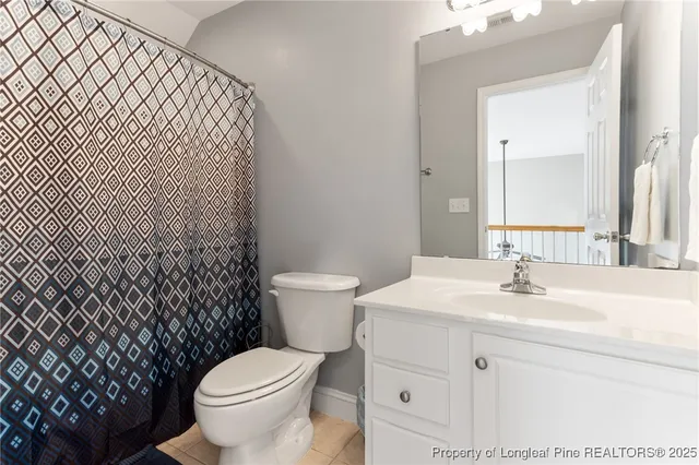 a bathroom with a sink toilet and mirror