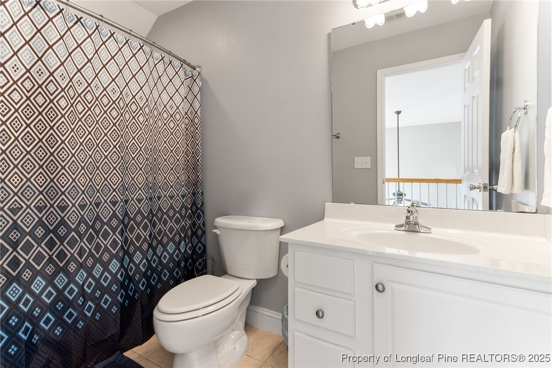 58 Cottswold Lane Spring Lake, NC 28390 - Photo 27 of 47 a bathroom with a sink toilet and mirror