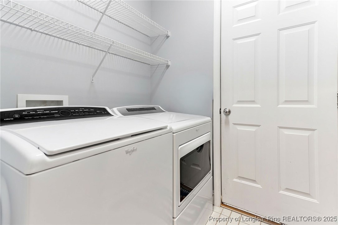 58 Cottswold Lane Spring Lake, NC 28390 - Photo 28 of 47 a utility room with dryer and washer