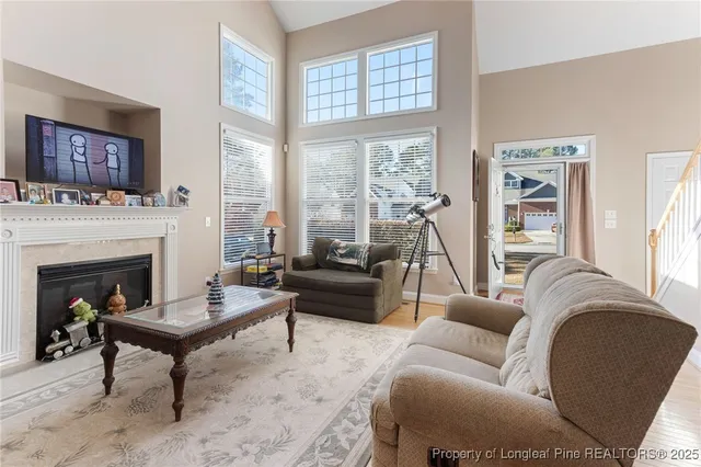 a living room with furniture and a fireplace