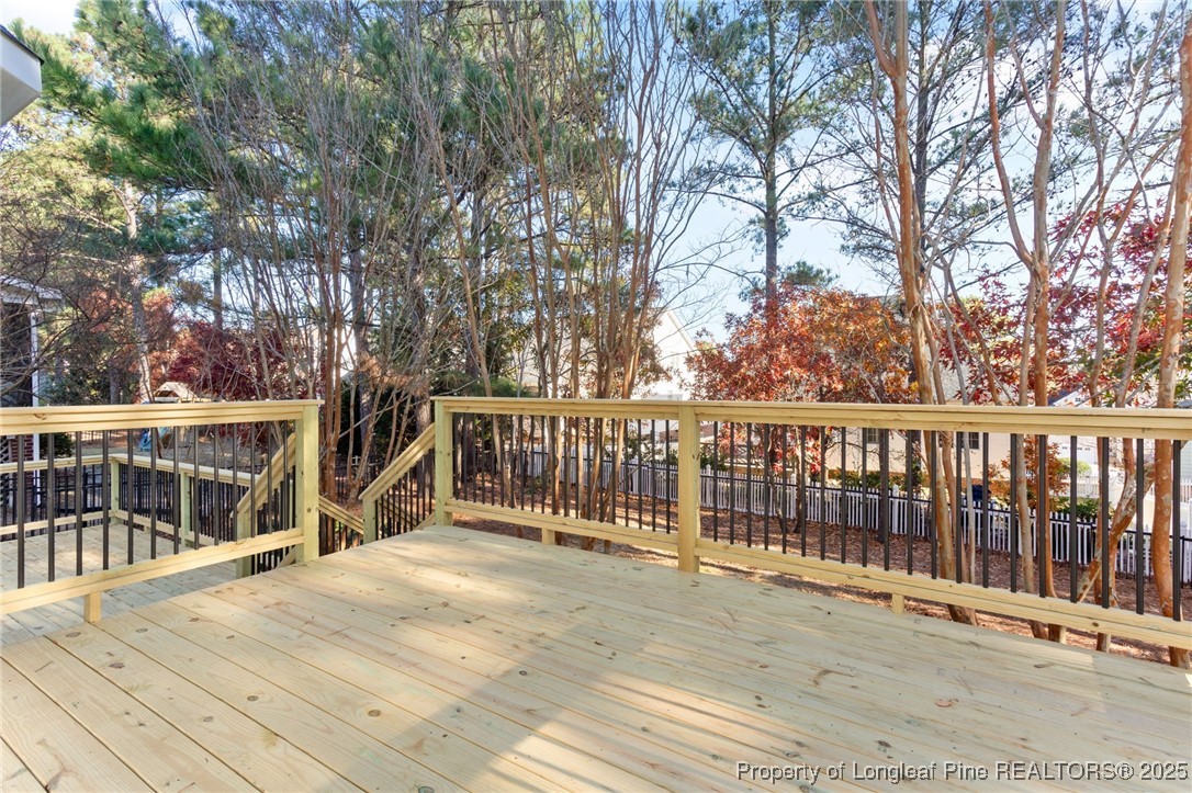 58 Cottswold Lane Spring Lake, NC 28390 - Photo 31 of 47 a view of a house with a wooden deck