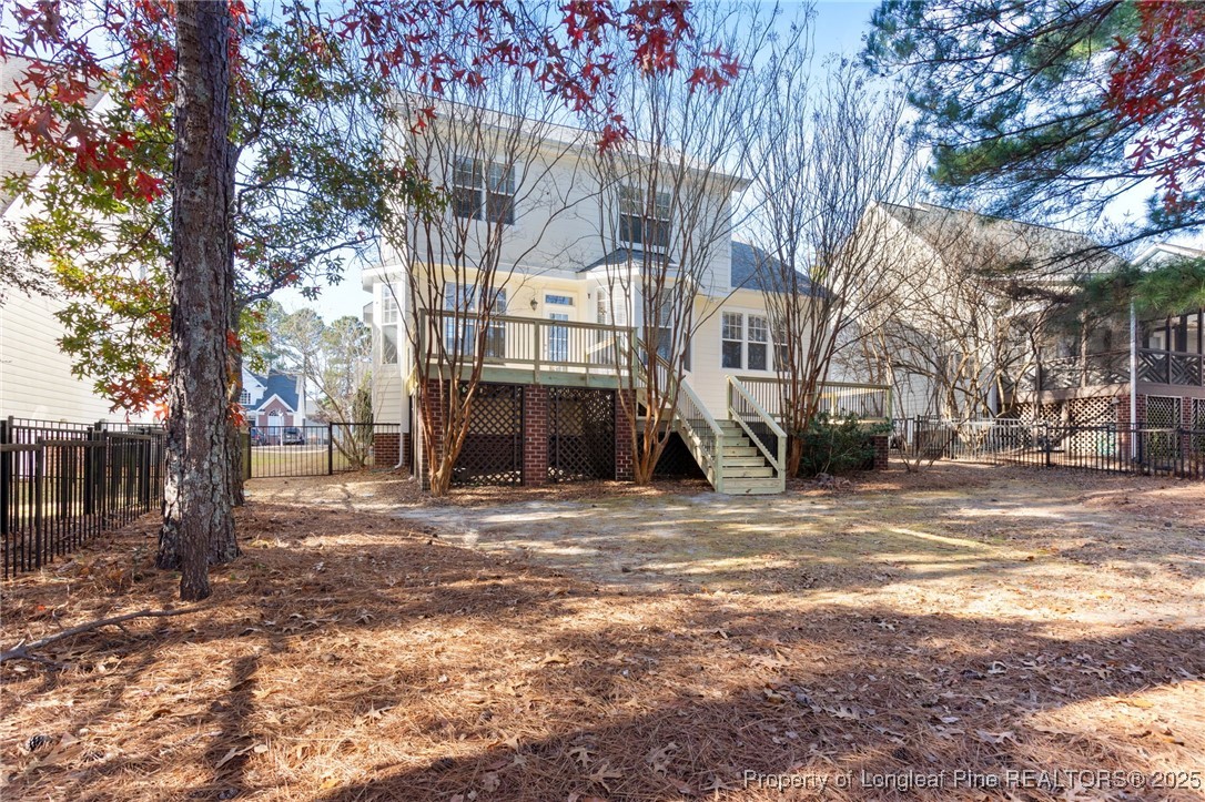 58 Cottswold Lane Spring Lake, NC 28390 - Photo 34 of 47 a view of a large house with trees in the background