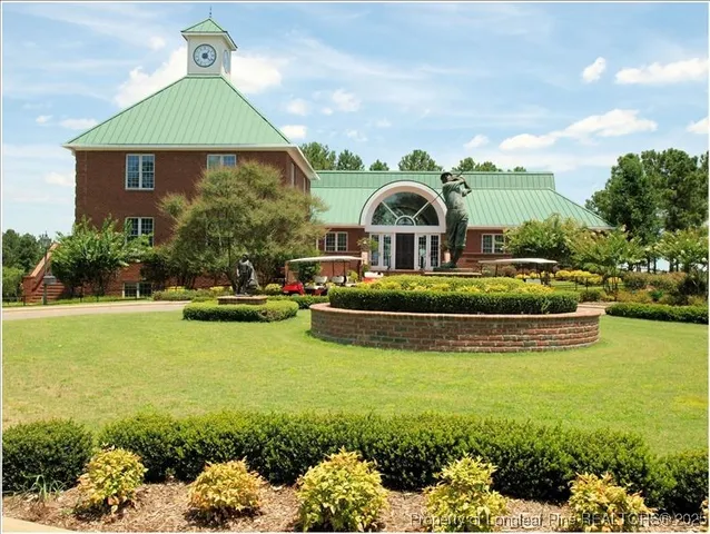 a front view of house with outdoor space and swimming pool