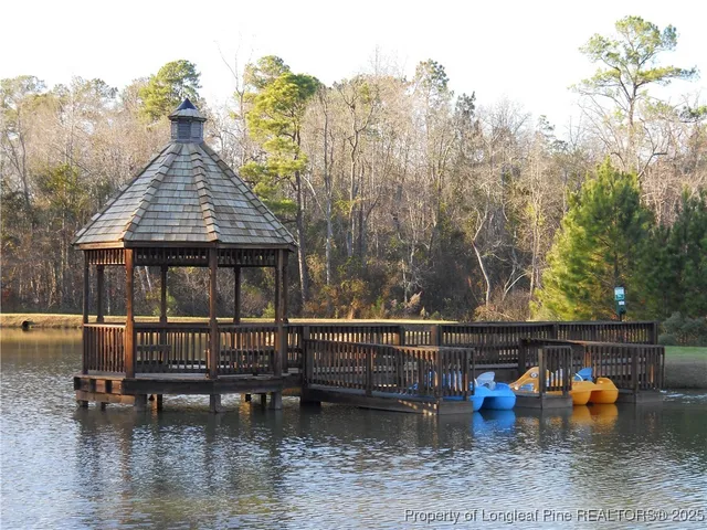 a view of a lake with a house in the background
