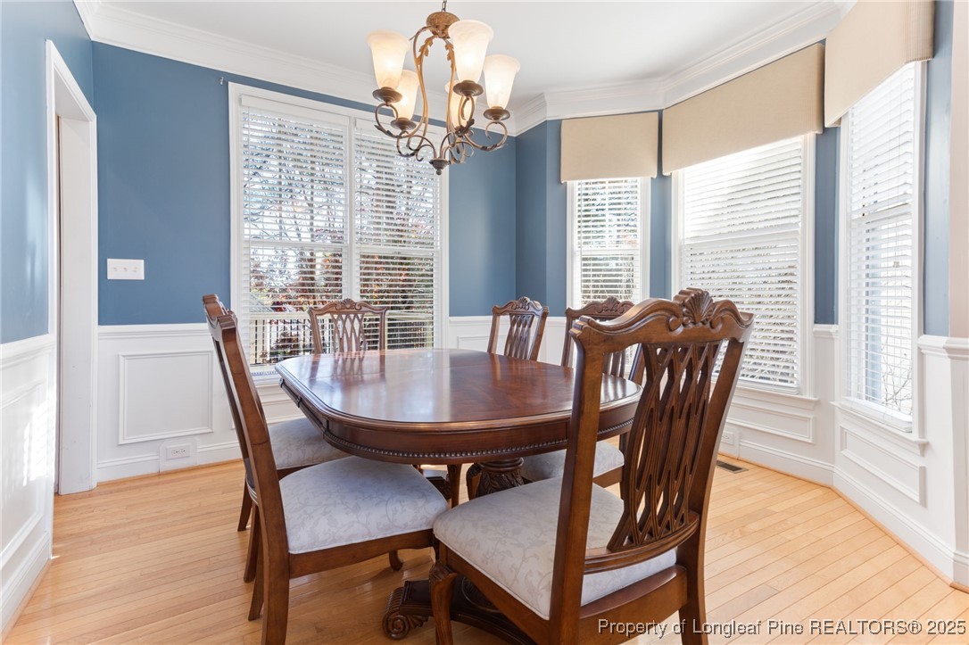 58 Cottswold Lane Spring Lake, NC 28390 - Photo 7 of 47 a view of a dining room with furniture window and wooden floor