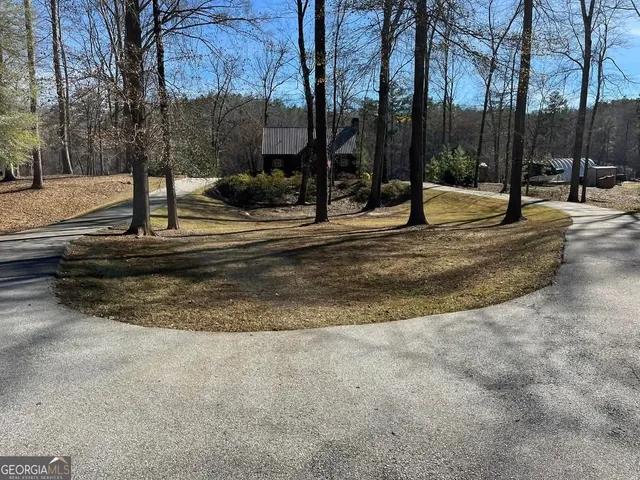 a living room with patio furniture and a fireplace