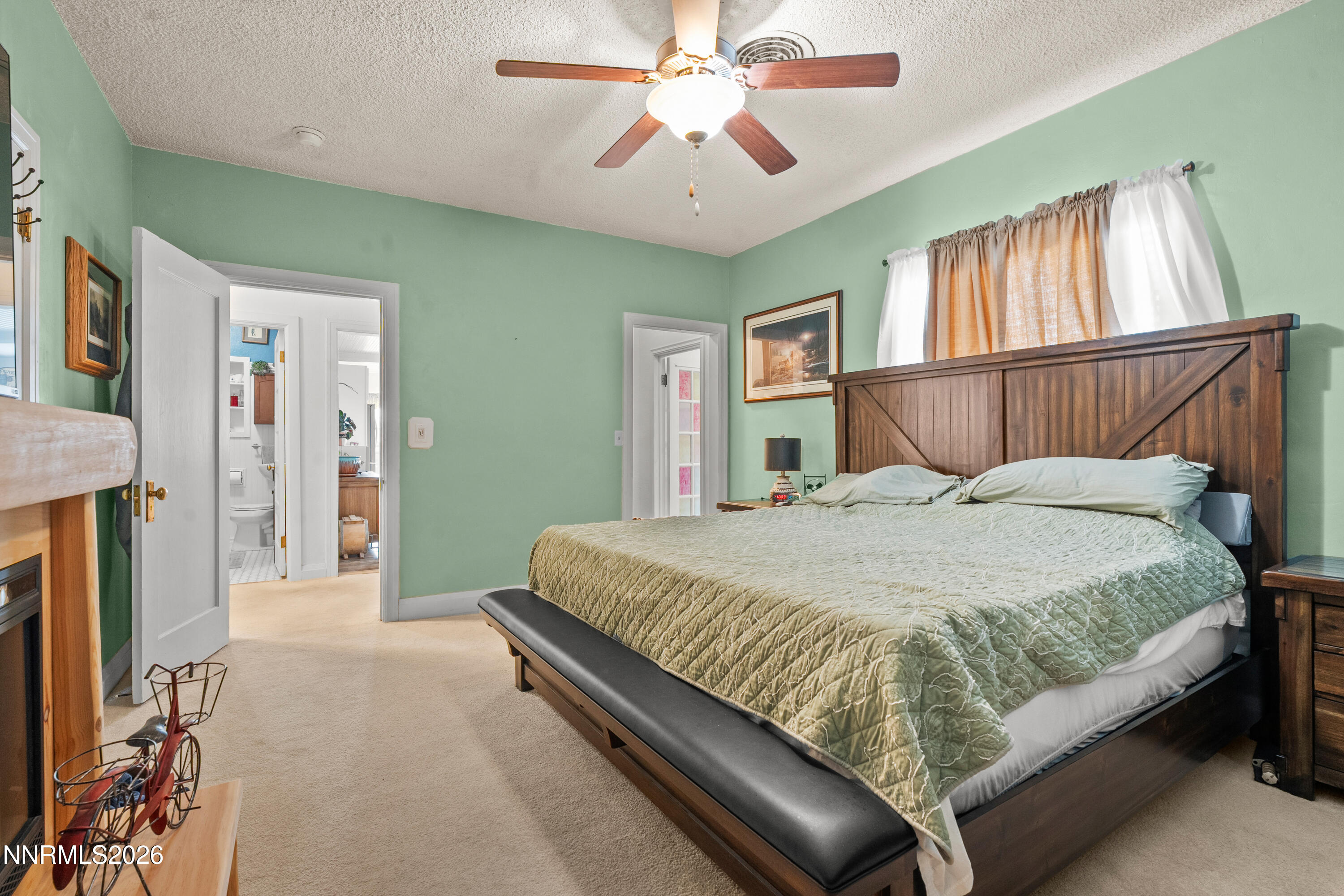 90 South Allen Street Fallon, NV 89406 - Photo 25 of 41 a bedroom with a balcony a bed and a chandelier