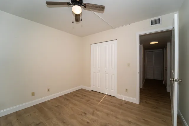 an empty room with wooden floor