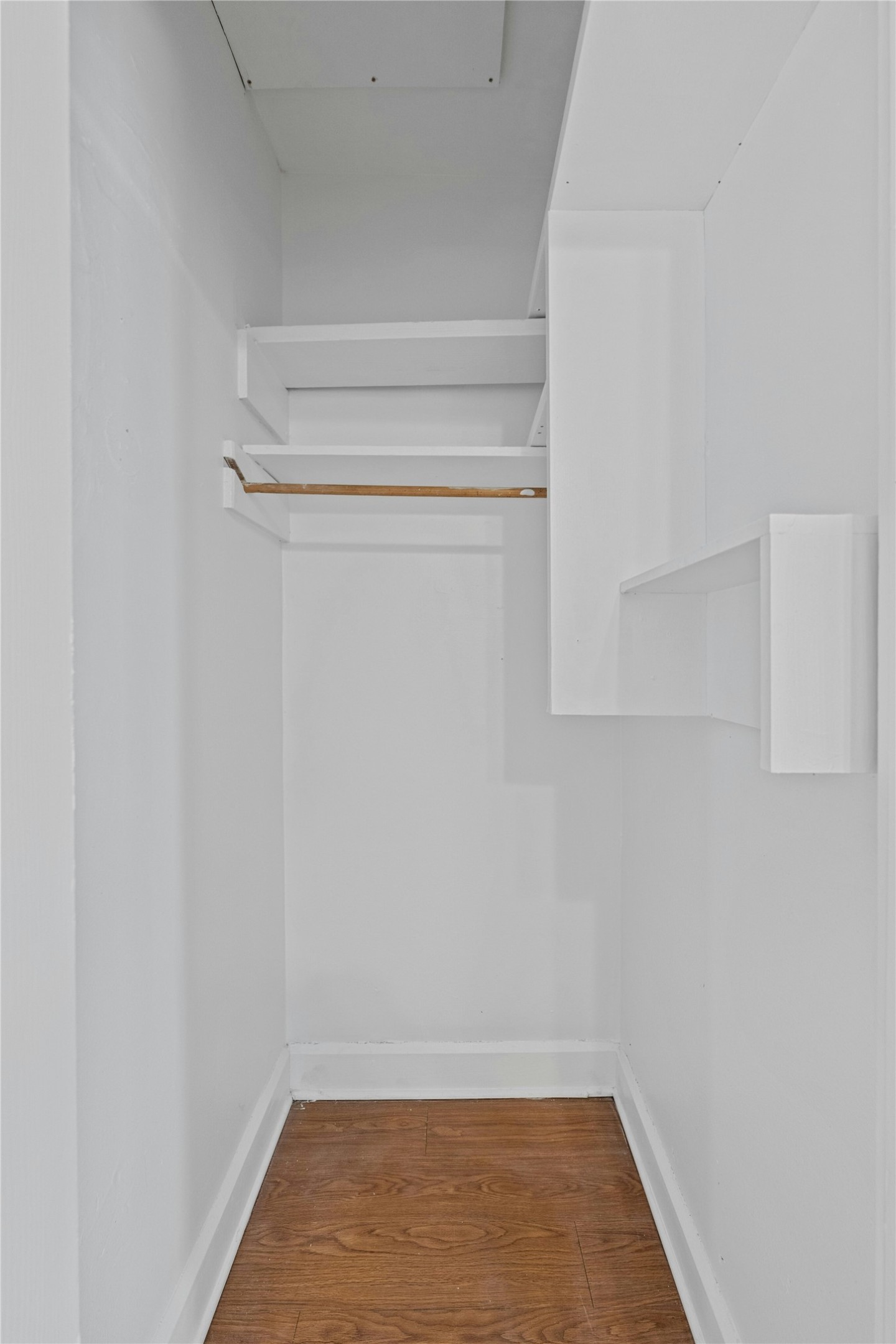 2201 Leon Street, Unit G Austin, TX 78705 - Photo 13 of 17 Built-in closet system featuring multiple shelves and a hanging rod