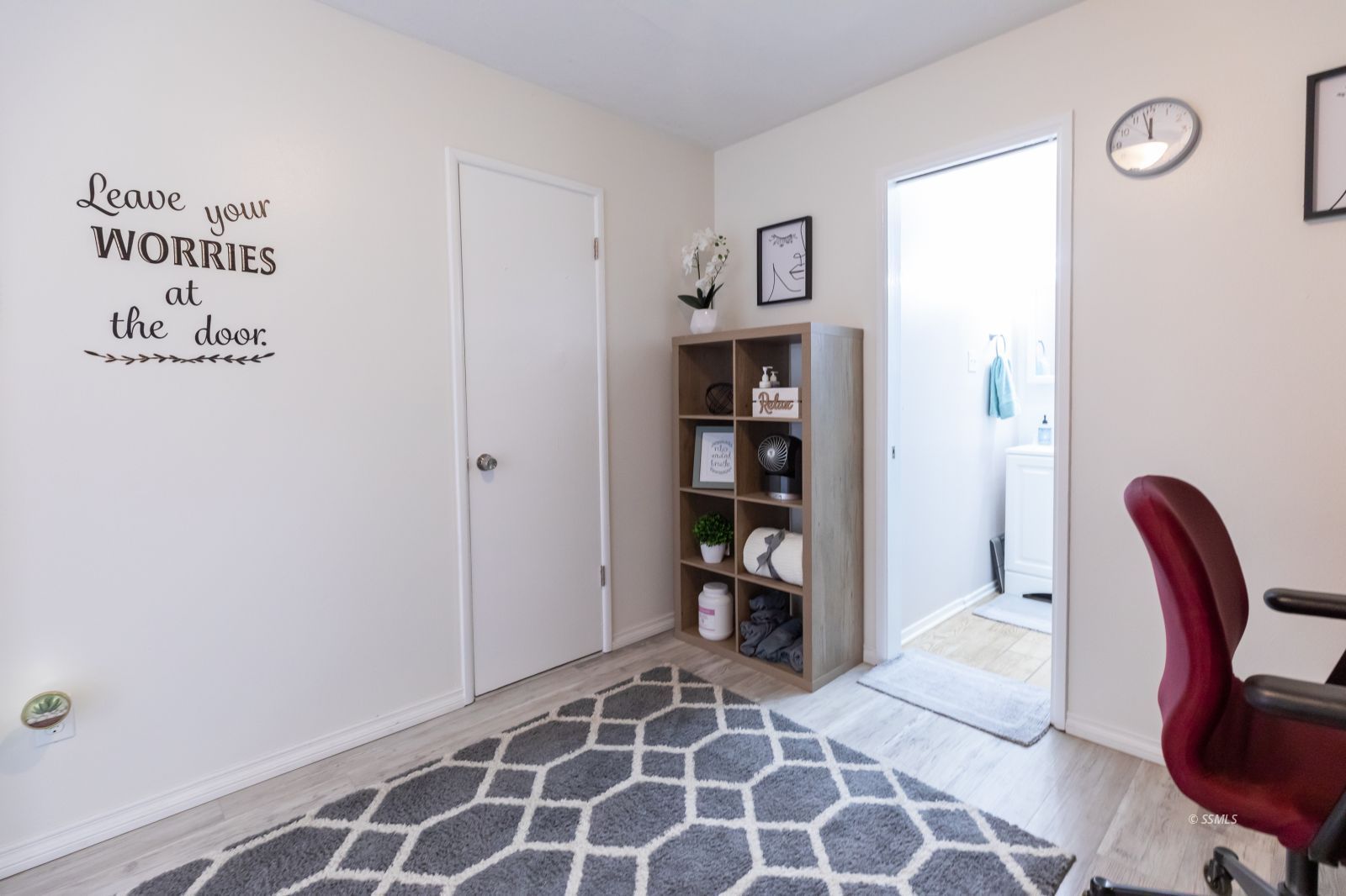 317 South Silver Ridge Street Ridgecrest, CA 93555 - Photo 16 of 28 a bedroom with a bed and a chair